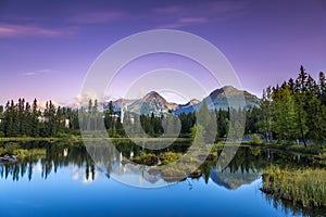 The sunrise over a lake in the park High Tatras