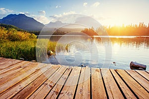 The sunrise over a lake in the park High Tatras.