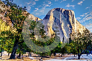 Sunrise over the large granite El Capitan rock under colorful sky. Viewed from Yosemite Valley in Yosemite National Park