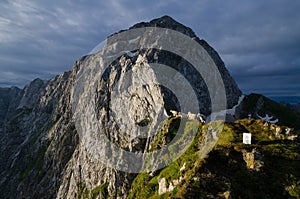 Sunrise over Mangart mountain with sheeps in foreground, Julian Alps, Mangart Pass, Slovenia, Triglav national park, Europe