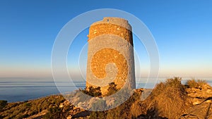 Sunrise over Mediterranean sea. Historic Torre Vigia De Cerro Gordo