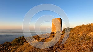 Sunrise over Mediterranean sea. Historic Torre Vigia De Cerro Gordo