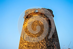 Sunrise over Mediterranean sea. Historic Torre Vigia De Cerro Gordo, a watchtower