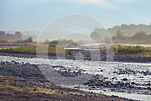 Sunrise over the mountain river in the morning