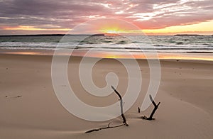 Sunrise over the ocean with beautiful unspoilt beach