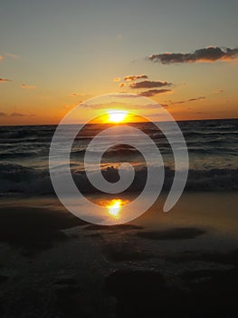 Sunrise over the ocean horizon Cancun Mexico beach sun sky clouds sunlight reflection travel tourism