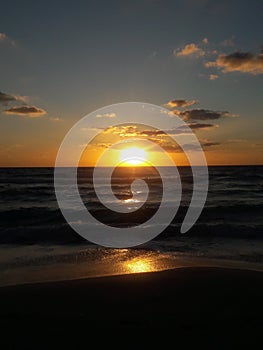 Sunrise over the ocean horizon Cancun Mexico beach sun sky clouds sunlight reflection travel tourism