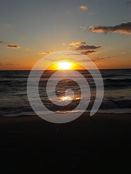 Sunrise over the ocean horizon Cancun Mexico beach sun sky clouds sunlight reflection travel tourism