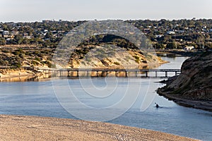 Sunrise over the onkaparinga river foot bridge located at port noarlunga south australia on january 16th 2022