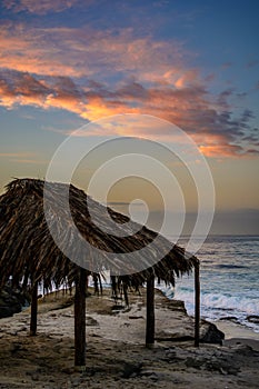 Hut overlooking the Pacific ocean at sunrise