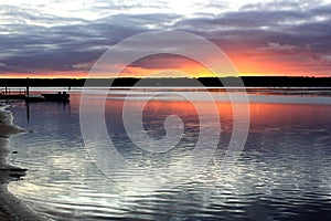 Sunrise over peacful scenic sea inlet photo