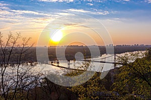 Sunrise over the pedestrian bridge over the Dnieper River in Kiev, Ukraine