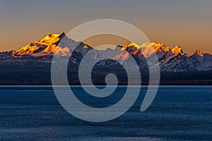 Sunrise over the Pekucuo lake and Shishapangma snow mountain group in Xigaze photo