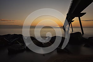 Sunrise over the pont del petroli de badalona on a friday