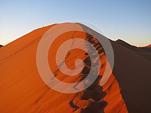 Sunrise over red Dune 45 in Sossusvlei, Namibia