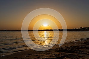 Sunrise over the Red Sea on the beach in Hurghada, Egypt