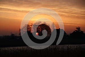 Sunrise over river Hollandse IJssel with colorful sky in the Net