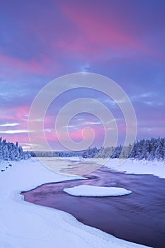 Sunrise over river rapids in Finnish Lapland photo