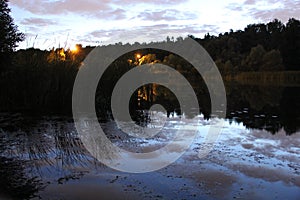 Sunrise over the river. Reflection