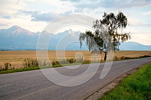 Sunrise over a road to High Tatra mountains