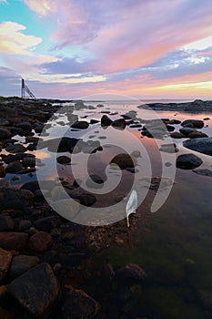 Sunrise over rocky coastline