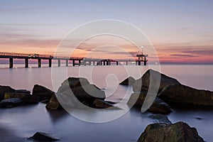 Sunrise over the sea bridge in Burgas bay, Bulgaria