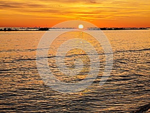 Sunrise over the sea on an empty beach in Montesilvano, Abruzzo