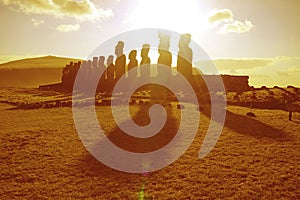 Sunrise over the silhouette of Moai statues at Ahu Tongariki celemonial platform on Easter Island, Chile