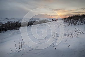 Sunrise over snow covered fields of North Dakota, USA