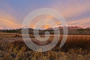 Sunrise over snowcapped mountains