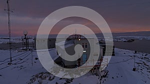 Sunrise over vernadsky arctic station aerial view