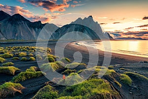 Sunrise over Vestrahorn mountain on black sand beach in Stokksnes peninsula at Iceland