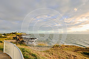 Sunrise over the water from the Lambert`s Beach lookout, Mackay Queensland Australia