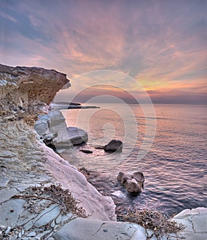 A sunrise over white rocks at governon's beach near limasol, cyp