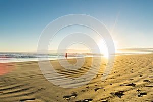 Sunrise over wide flat sandy beach at Ohope Whakatane