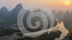 Sunrise over Xingping karsts hills in Xianggong hill and Li river at sunset near Yangshuo in Guanxi province, China