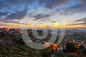 Sunrise in Palestine, a peaceful landscape at dawn. night lights in old historical biblical city Bethlehem