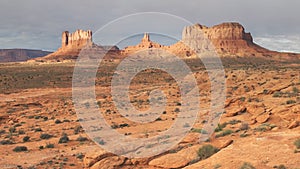 A sunrise panning shot of saddleback mesa at monument valley in utah