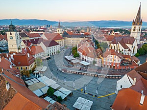 Sunrise panorama of Piata Mica in Sibiu, Romania