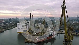 Sunrise panorama Remontova shipyard with ships docked .