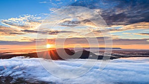 Sunrise at Pha Mo I Daeng Cliff and mist