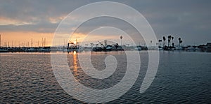 Sunrise pink sky over Channel Islands harbor in Port Hueneme on the gold coast of California USA