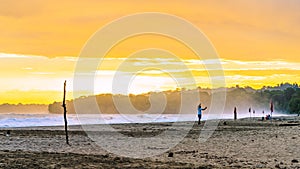 Sunrise at Playa Cocles, beautiful tropical Caribbean beach, Puerto Viejo, Costa Rica east coast, tourists meet the dawn