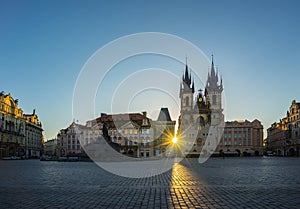 Sunrise in Prague old town square with view of Tyn Church in Czech Republic