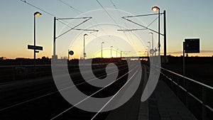 Sunrise from a railway station in Germany photo