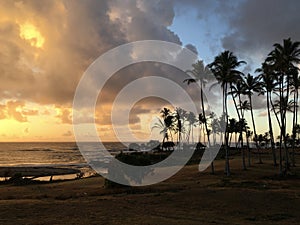 Sunrise before Rain in August in Wailua Bay between Kukui and Hikinaakala Heiaus on Kauai Island, Hawaii.