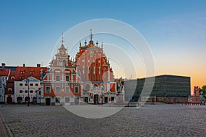 Sunrise at Ratslaukums square with the House of Blackheads in ol