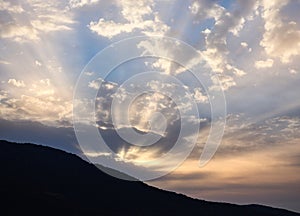 Sunrise Rays Struggling Through Dark Clouds