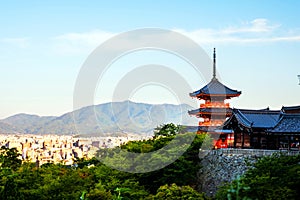 A sunrise with the red Kiyomizu-dera temple on a hill in Kyoto, Japan