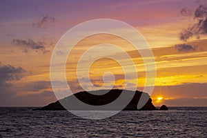 Sunrise with red sky on the beach of Es Canar, Ibiza Island photo